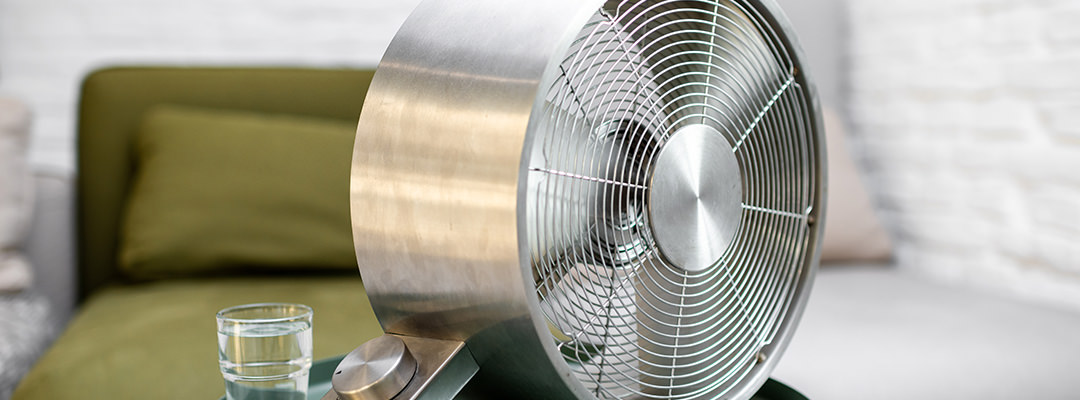 A fan in a bedroom