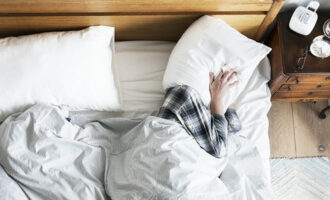 A person having trouble sleeping because of the noise